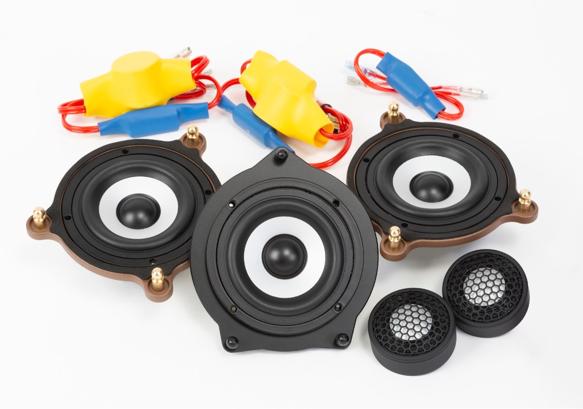 Streamlined upgrade the system by utilizing the factory subwoofer.